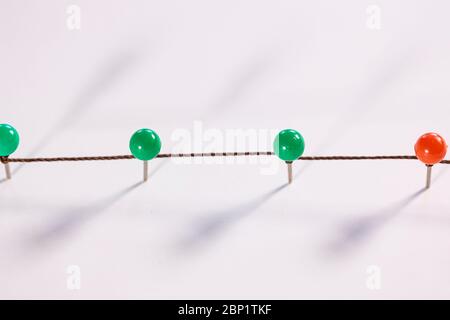 Line of thumbtacks. Social distancing concept Stock Photo