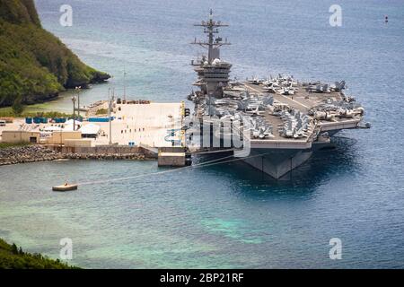 The U.S. Navy Nimitz-class aircraft carrier USS Theodore Roosevelt moored pier side at Naval Base Guam May 15, 2020 in Apra Harbor, Guam. The COVID-negative crew returned from quarantine and is preparing to return to sea to continue their scheduled deployment to the Indo-Pacific. Stock Photo