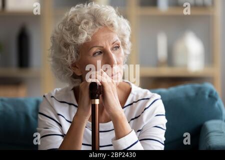 Pondering stressed disabled woman thinking of health problem. Stock Photo