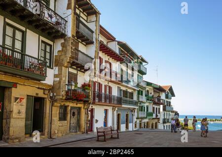 Hondarribia, Gipuzkoa, Basque Country, Spain - July 18th, 2019 : Colourful facades of traditional buildings in the Plaza de Armas main square, the hea Stock Photo