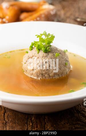 bavarian liver dumpling soup on wood Stock Photo
