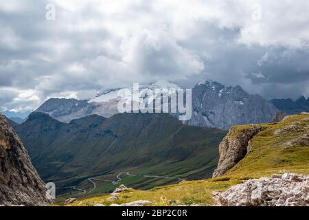 View to the beautiful mountain marmolada with the north face and glacier in the dolomites in Italy. Stock Photo