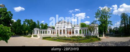 Ultrwaide distorted view of the historic Casino in the Central Park of Cluj-Napoca city in the Transylvania region of Romania where events like the Un Stock Photo