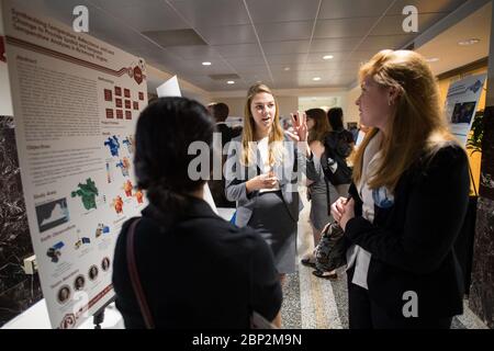 2018 Earth Science Applications Showcase  Students and young professionals discuss their projects at the Earth Science Applications Showcase Wednesday, August 1, 2018 at NASA Headquarters in Washington. Every summer, participants in NASA’s Applied Sciences’ DEVELOP National Program come to NASA Headquarters and present their research projects. DEVELOP is a training and development program where students work on Earth science research projects, mentored by science advisers from NASA and partner agencies, and extend research results to local communities. Stock Photo