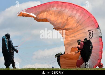 Kozakov, Czech Republic. 17th May, 2020. A Paraglider prepare to take off from a Kozakov (100 kilometers north from Prague) in the Czech Republic. Paragliding is a recreational and competitive flying sport. The pilot sits in a harness suspended below a fabric wing, whose shape is formed by the pressure of air entering vents in the front of the wing. Credit: Slavek Ruta/ZUMA Wire/Alamy Live News Stock Photo