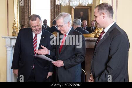 Morhard Sworn In As NASA Deputy Administrator  Jim Morhard, left, is sworn in as the 14th NASA Deputy Administrator by Senate Majority Leader Mitch McConnell, R-Ky., as NASA Administrator Jim Bridenstine looks on, Wednesday, Oct. 17, 2018 in the United States Capitol. Stock Photo
