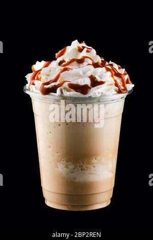 Caramel milkshake in take away cup isolated on black background Stock Photo