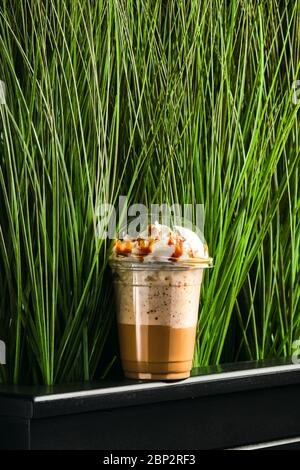 Caramel milkshake in take away cup Stock Photo