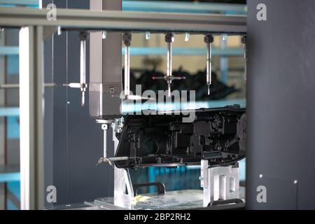 Close up of a 3D dimension measurement plastic parts by CMM, 3D automatic measuring system Stock Photo