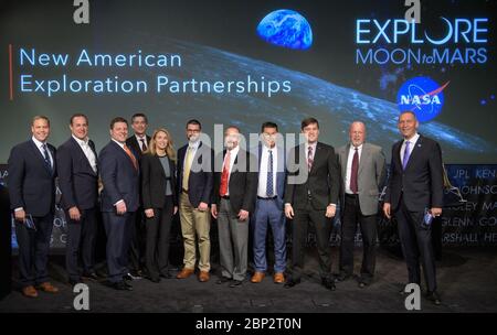 Commercial Lunar Payload Services (CLPS)  NASA Administrator Jim Bridenstine, left, and  NASA Associate Administrator for the Science Mission Directorate Thomas Zurbuchen, right, pose for a photograph with the representatives of the nine U.S. companies that are eligible to bid on NASA delivery services to the lunar surface through Commercial Lunar Payload Services (CLPS) contracts, Thursday, Nov. 29, 2018 at NASA Headquarters in Washington. The representatives of the companies are: Steve Altemus, President and CEO of Intuitive Machines; 2nd from left, Sean Mahoney, CEO, Masten Space Systems In Stock Photo