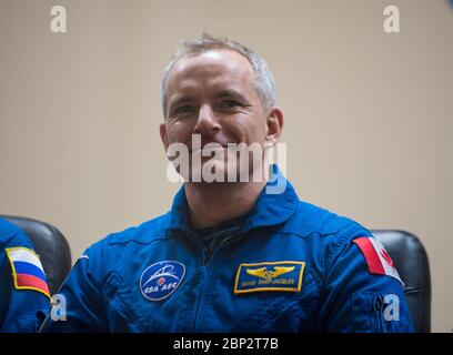 Expedition 58 Press Conference  Expedition 58 Flight Engineer David Saint-Jacques of the Canadian Space Agency (CSA) is seen during a press conference, Sunday, Dec. 2, 2018 at the Cosmonaut Hotel in Baikonur, Kazakhstan. Launch of the Soyuz rocket is scheduled for Dec. 3 and will carry Saint-Jacques, Soyuz Commander Oleg Kononenko of Roscosmos, and Flight Engineer Anne McClain of NASA, into orbit to begin their six and a half month mission on the International Space Station. Stock Photo