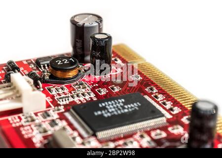 Circuit board with condenser and microchips closeup electronic, copper cables, macro white background Stock Photo