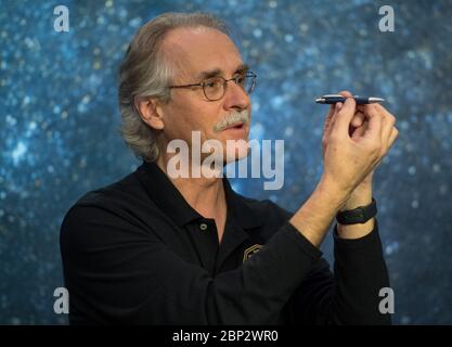 New Horizons Ultima Thule Flyby  New Horizons co-investigator John Spencer of the Southwest Research Institute (SwRI), Boulder, CO, uses a pen to demonstrate how Ultima Thule might be rotating during a press conference prior to the flyby of the Kuiper Belt object by the New Horizons spacecraft, Monday, Dec. 31, 2018 at Johns Hopkins University Applied Physics Laboratory (APL) in Laurel, Maryland. Stock Photo
