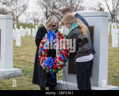 Day of Remembrance  NASA Administrator Jim Bridenstine places a wreath at the Space Shuttle Columbia Memorial with Kristy Carroll, left, and daughter Vivian Carroll who were friends of Space Shuttle Columbia pilot William McCool, during NASA's Day of Remembrance, Thursday, Feb. 7, 2019, at Arlington National Cemetery in Arlington, Va. Wreaths were laid in memory of those men and women who lost their lives in the quest for space exploration. Stock Photo