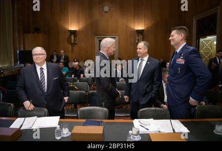 Senate Aviation and Space Subcommittee Hearing  Kevin O’Connell, Director, Office of Space Commerce, Department of Commerce, left, Robert Cardillo, Former Director, National Geospatial-Intelligence Agency, NASA Administrator Jim Bridenstine, and Lt. Gen. David D. Thompson, Vice Commander, Space Command, United States Air Force, right, gather ahead of testifying along with Col. Pamela A. Melroy, United States Air Force (ret.) (former astronaut), before the Aviation and Space Subcommittee of the Senate Commerce, Science, and Transportation Committee, Tuesday, May 14, 2019, at the Dirksen Senate Stock Photo