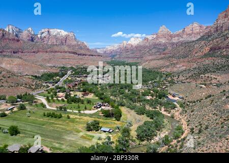 Aerial views above Springdale, Utah set in a dramatic landscape at the entrance to Zion National Park Stock Photo