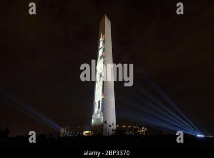 Apollo 11 Saturn V Rocket Projected On The Washington Monument  A full-sized, 363-foot Saturn V rocket is projected onto the east face of the Washington Monument by the Smithsonian’s National Air and Space Museum 50 years to the day after astronauts Neil Armstrong, Michael Collins, and Buzz Aldrin launched on Apollo 11, the first mission to land astronauts on the Moon, Tuesday, July 16, 2019. On Friday, July 19, and Saturday, July 20, a special 17-minute show, “Apollo 50: Go for the Moon” will combine full-motion projection-mapping artwork on the monument and archival footage to recreate the l Stock Photo