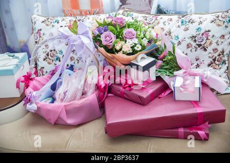Red gift box with red ribbon, blur office desk background . Red gift box. Closed with red ribbon. Stock Photo