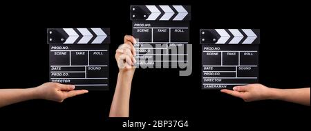 Set of film clapper boards and human hands isolated on black background Stock Photo