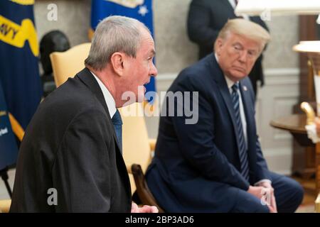 U.S. President Donald Trump meets with New Jersey Gov. Phil Murphy to discuss the COVID-19, coronavirus pandemic in the Oval Office of the White House April 30, 2020 in Washington, D.C. Stock Photo