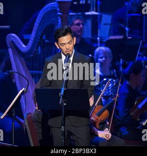 NASA Celebrates 60th Anniversary with National Symphony Orchestra  Actor John Cho recites a poem during the &quot;National Symphony Orchestra Pops: Space, the Next Frontier&quot; event celebrating NASA's 60th Anniversary, Friday, June 1, 2018 at the John F. Kennedy Center for the Performing Arts in Washington. The event featured music inspired by space including artists Will.i.am, Grace Potter, Coheed &amp; Cambria, John Cho, and guest Nick Sagan, son of Carl Sagan. Stock Photo