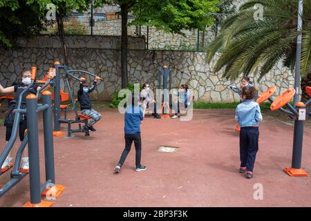 ISTANBUL,TURKEY,MAY 13,2020: The children took fresh air with their families at the kindengarden near Maiden's Tower in Uskudar. Stock Photo