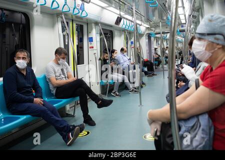 ISTANBUL,TURKEY,MAY 13,2020: View of passengers inside the Marmaray metro, an intercontinental commuter rail line, train during coronavirus days. Stock Photo