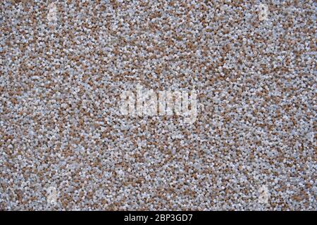 close view of the wall surface, decorative finishing, heat insulation granules or granite particles Stock Photo