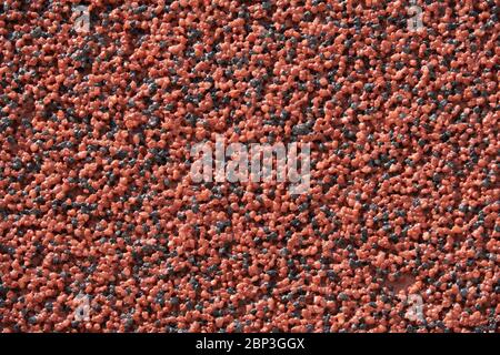 close view of the wall surface, decorative finishing, heat insulation granules or granite particles Stock Photo