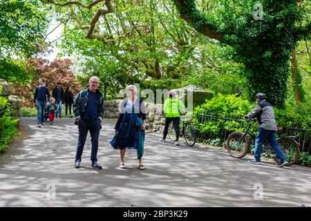 People enjoying Sunday walk in the St. Stephen Green Park during pandemic. Visitors reminded to adhere Covid-19 social distancing rule in public space. Stock Photo
