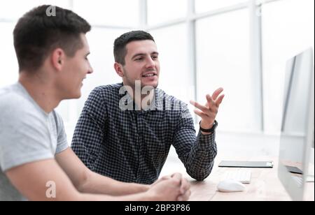 young employees sitting at the office Desk. Stock Photo