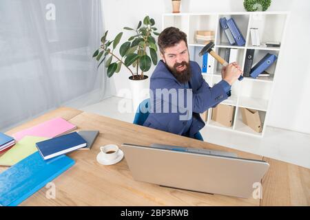 Software license agreement. Slow internet connection. Outdated software. Computer lag. Lagging system. Hate office routine. Man bearded crush computer. Destroy laptop. Hateful job. Bad computer. Stock Photo