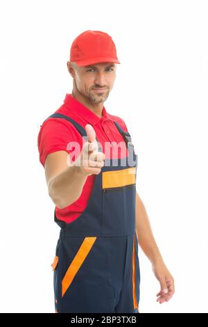 man wear working overall. handsome worker in uniform. building engineer pointing finger. mature skilled laborer in cap. building and construction concept. Handsome man wear overalls. Stock Photo