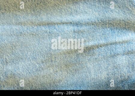 Denim texture macro shot. Blue light jeans background with copy space Stock Photo