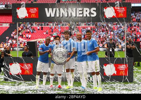 London, UK. 4th Aug, 2019. Raheem Sterling, David Silva, John Stones, Kyle Walker and Rodri of Manchester City celebrate with the Community Shield after the match between Liverpool and Manchester City at Wembley Stadium. Credit: Richard Calver/SOPA Images/ZUMA Wire/Alamy Live News Stock Photo