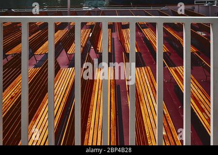 pattern created by empty benches on boat deck Stock Photo