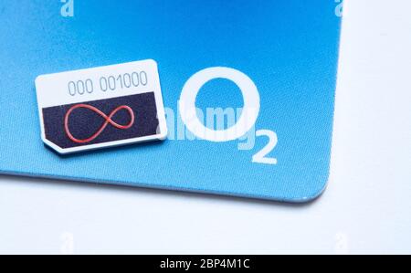 Stone / United Kingdom - May 17 2020: Virgin Media and O2 Sim cards with logos for mobile devices. Concept for merger of the two telecom companies. Ma Stock Photo