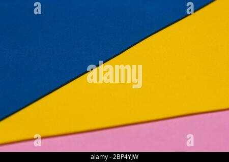 Three surfaces of three different colors that form an angle between them. Ideal for conceptual or creative backgrounds Stock Photo