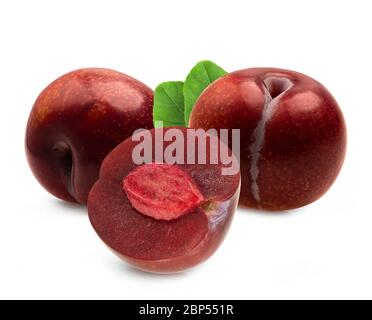 Isolated plums. Whole and a half of blue plum fruit isolated on white background, with clipping path Stock Photo
