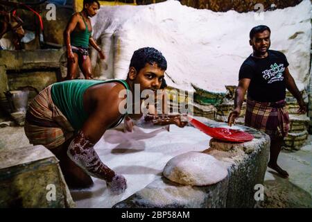 Chittagong, Bangladesh, December 22, 2017: Hard labor in a salt factory in Chittagong, Bangladesh Stock Photo