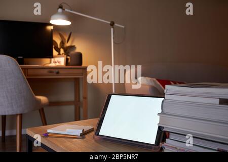 Tablet computer on the table with selective focus on the tablet camera. Online class and video conferencing at home. Stock Photo
