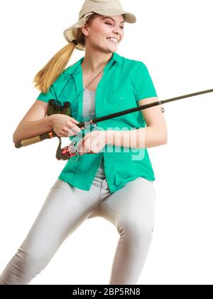 Fishery, spinning equipment, angling sport and activity concept. Happy smiling woman with fishing rod. Stock Photo
