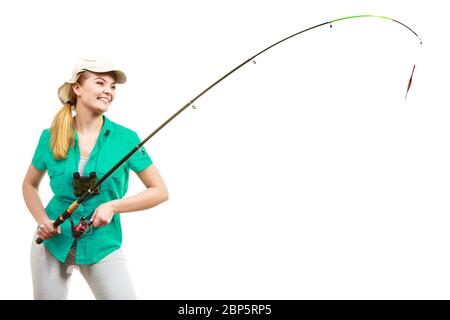 Fishery, spinning equipment, angling sport and activity concept. Happy smiling woman with fishing rod. Stock Photo