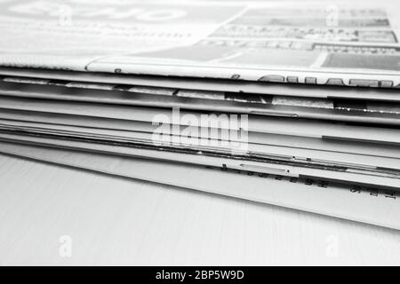Newspaper on the wooden table Stock Photo