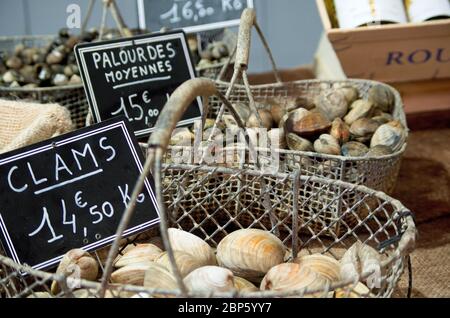 Clams on sale on a French market stall Stock Photo