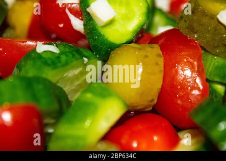 Vegetable salad sliced tomatoes, cucumbers, onions and pickles. Close up. Healthy food, fitness diet Stock Photo