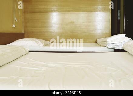 two beds in a cheap hotel room Stock Photo