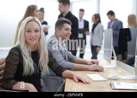 smiling young woman at the workplace, in the office Stock Photo