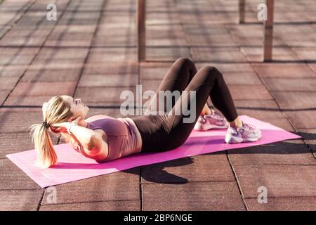 Premium Photo  Slim blond woman in tight sportswear practicing yoga,  standing in yoga pose, training muscles for flexibility. health care,  sports activity and workout concept