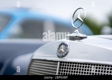 PAAREN IM GLIEN, GERMANY - JUNE 08, 2019: The famous three-beam star of Mercedes-Benz. Hood ornament, close-up. Die Oldtimer Show 2019. Stock Photo